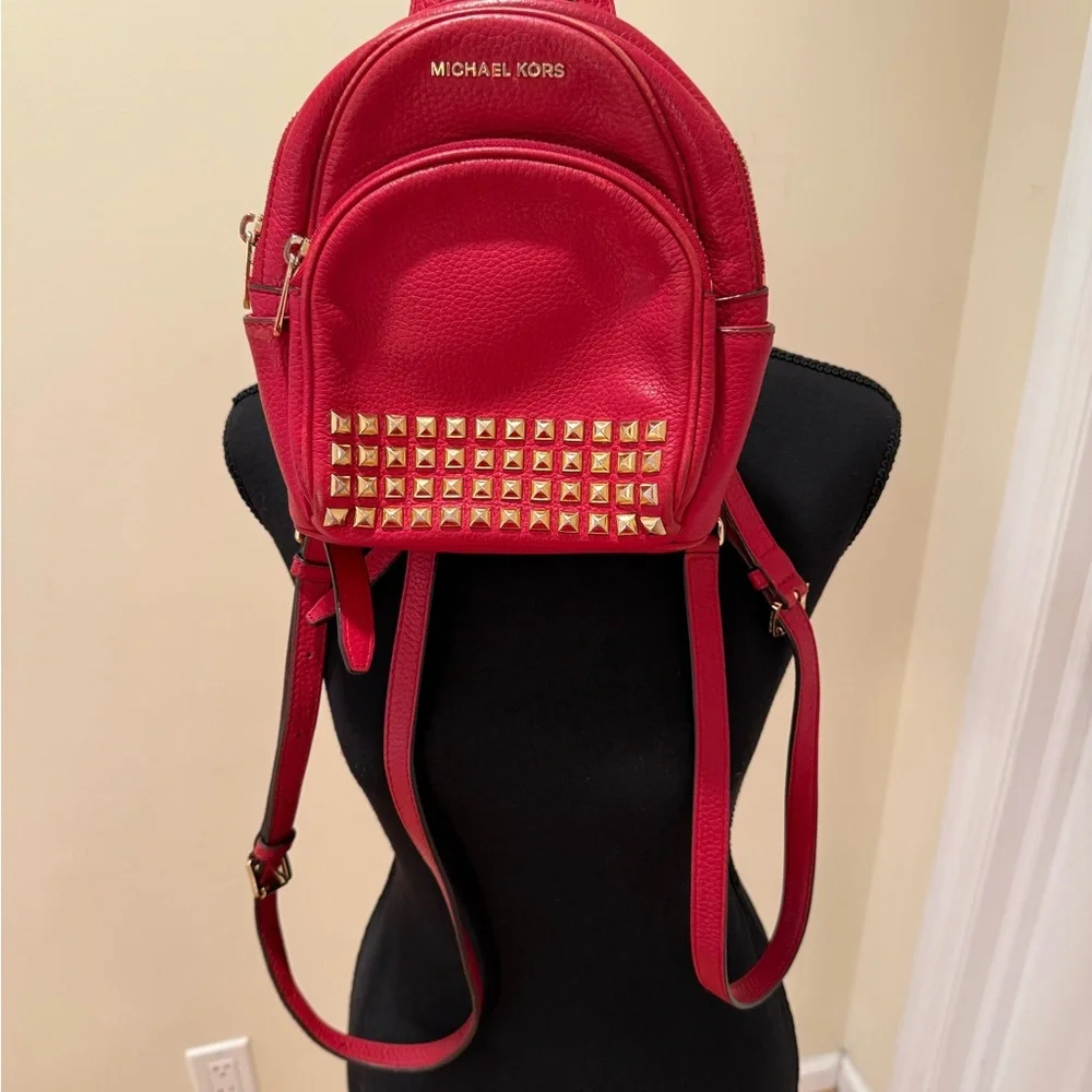 Michael Kors Abbey XS Studded Red Backpack with Gold Studs
Size 7 by 8 by 3 - Picture 4 of 16